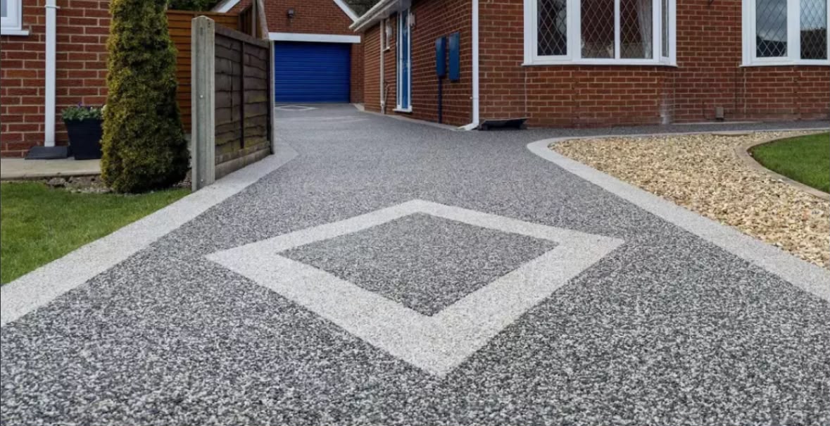 Grey resin bound driveway with contrasting diamond feature and white border
